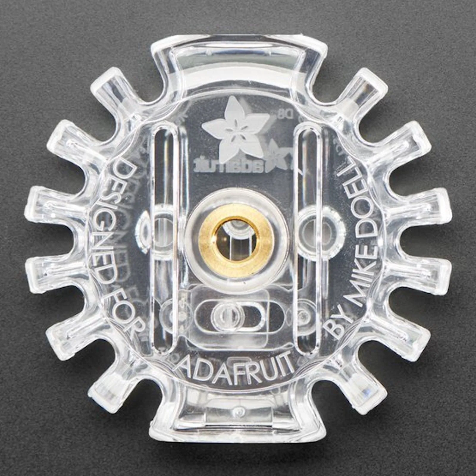 Underside of the empty enclosure, embossed "Designed for Adafruit by Mike Doell"