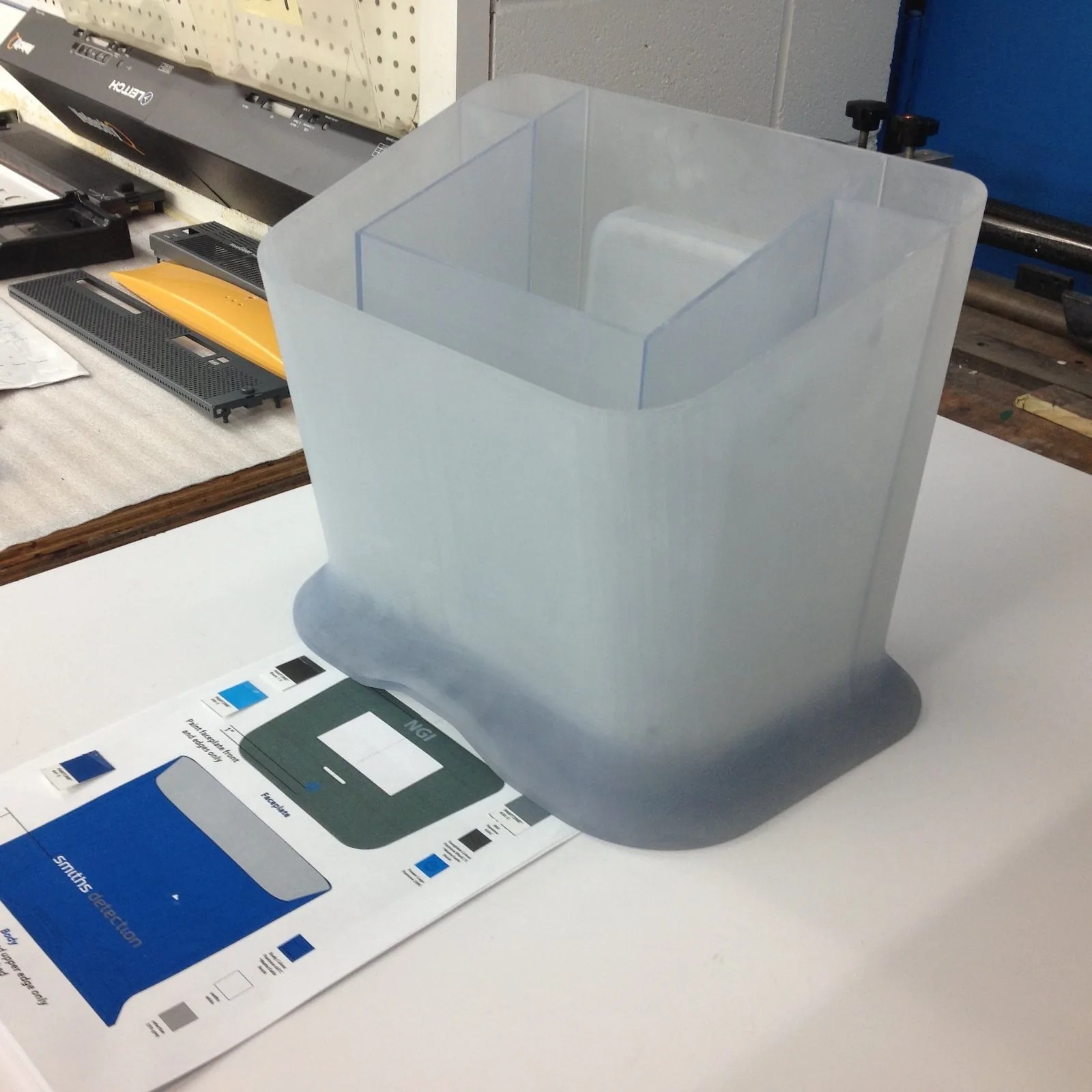 Translucent prototype housing beside colour and finish samples