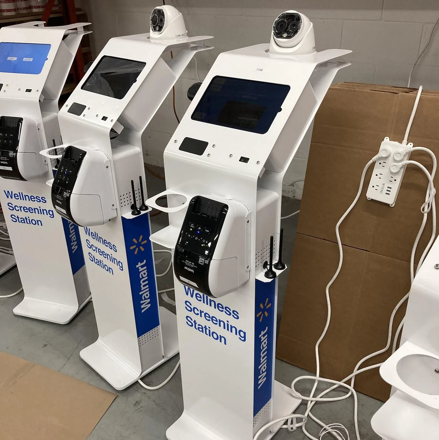 A row of finished Wellness Screening Stations lined up before deployment